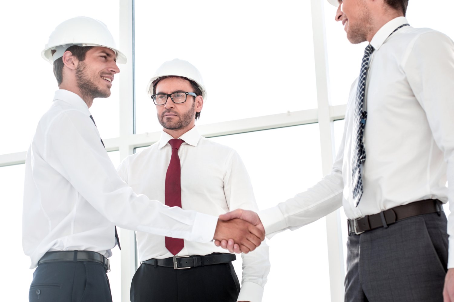 Two architects shaking hands after a meeting in office.concept of cooperation