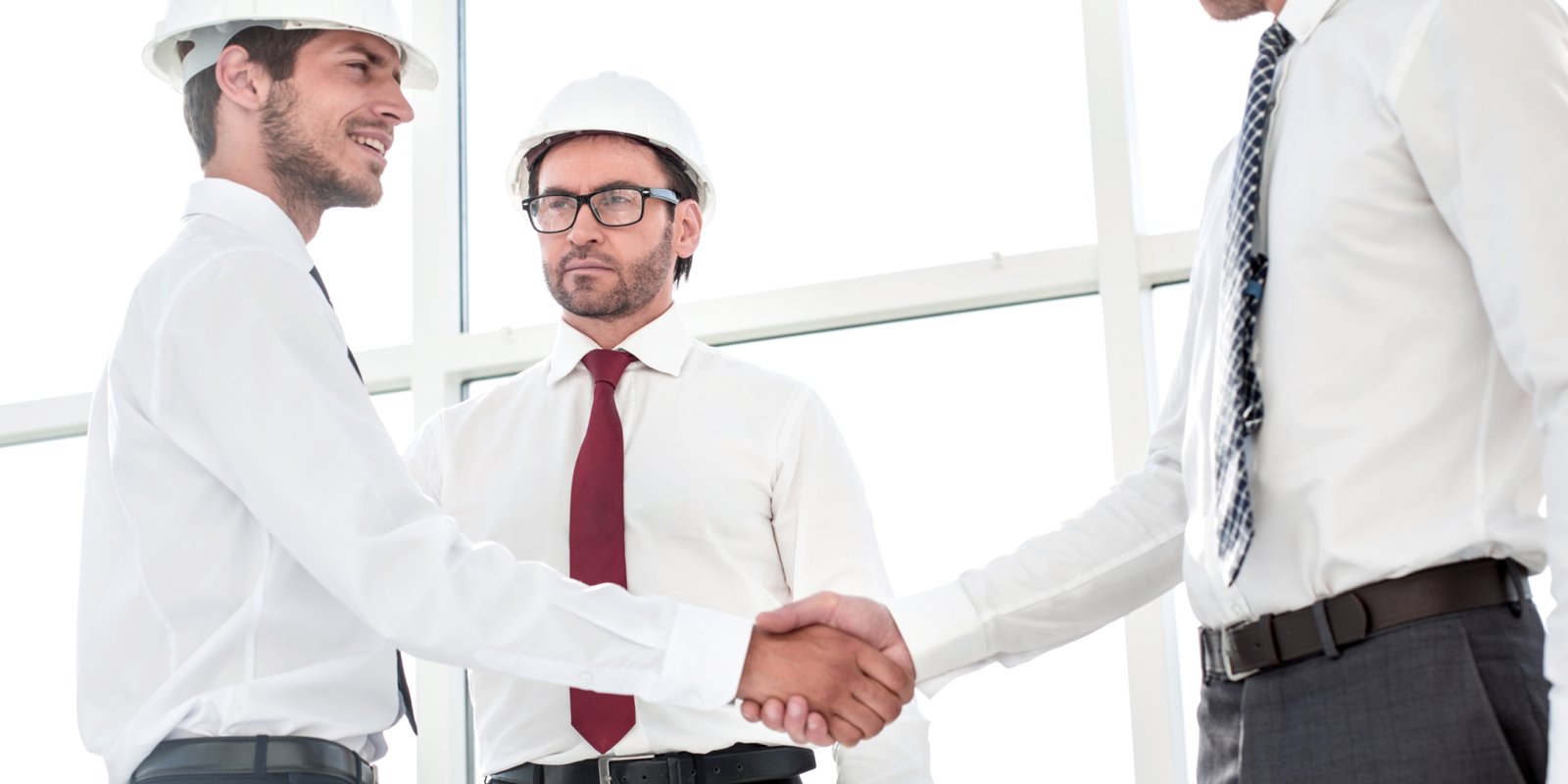 Two architects shaking hands after a meeting in office.concept of cooperation