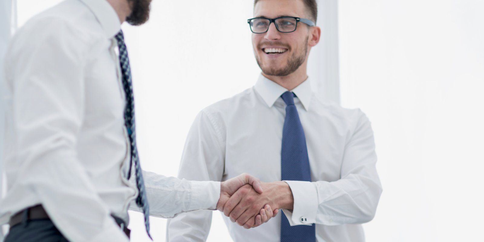 close up.business handshake of business people on a light background.concept of partnership